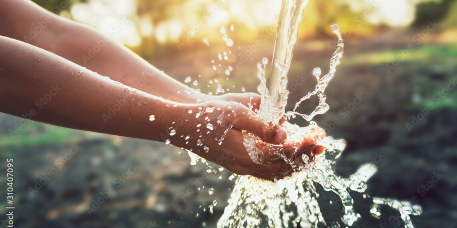 Water pouring on hand in morning ligth background